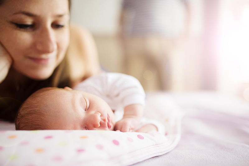 Mother and her sleeping baby