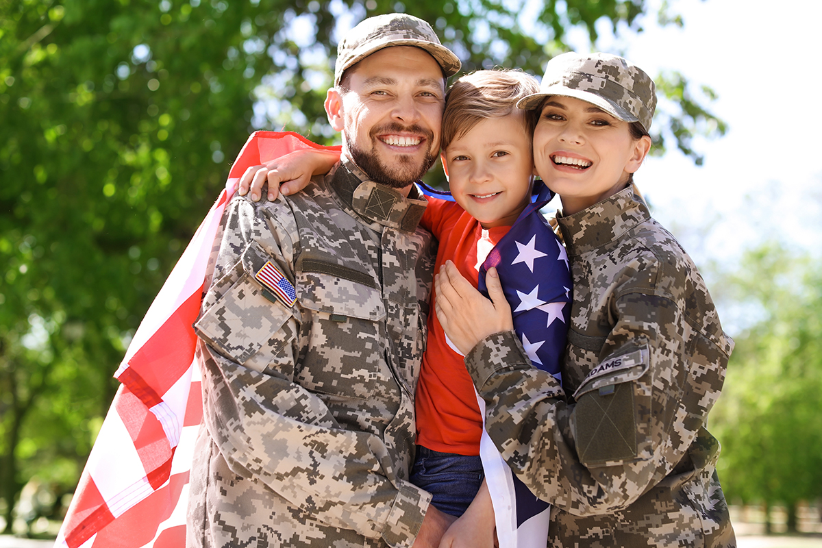 Happy military family with their son outdoors