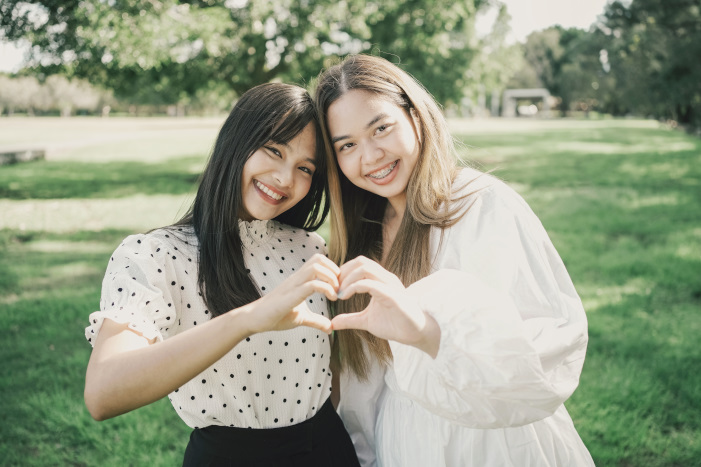 Asian women making hands in heart shape, heart health insurance, donation charity, world heart day, world mental health day concept